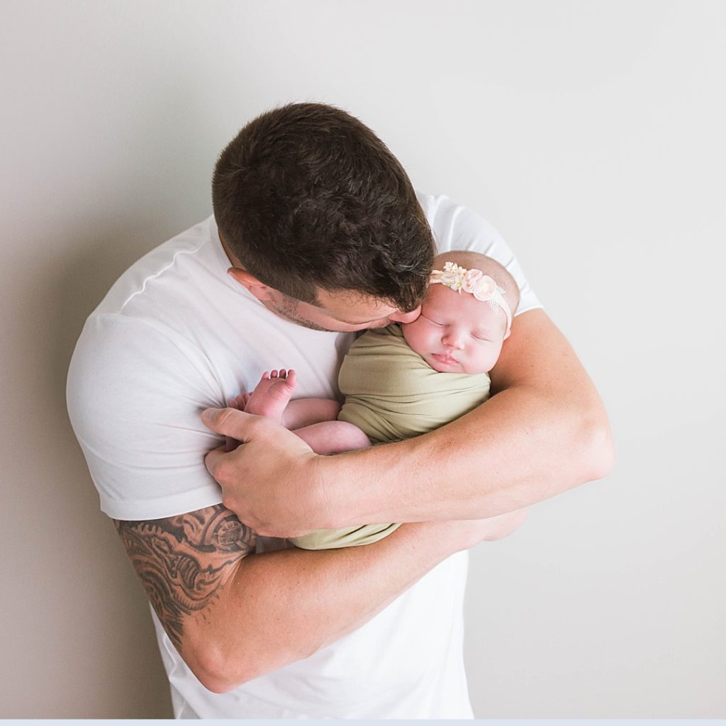 Dad in white t-shirt showing what men should wear during a maternity photoshoot