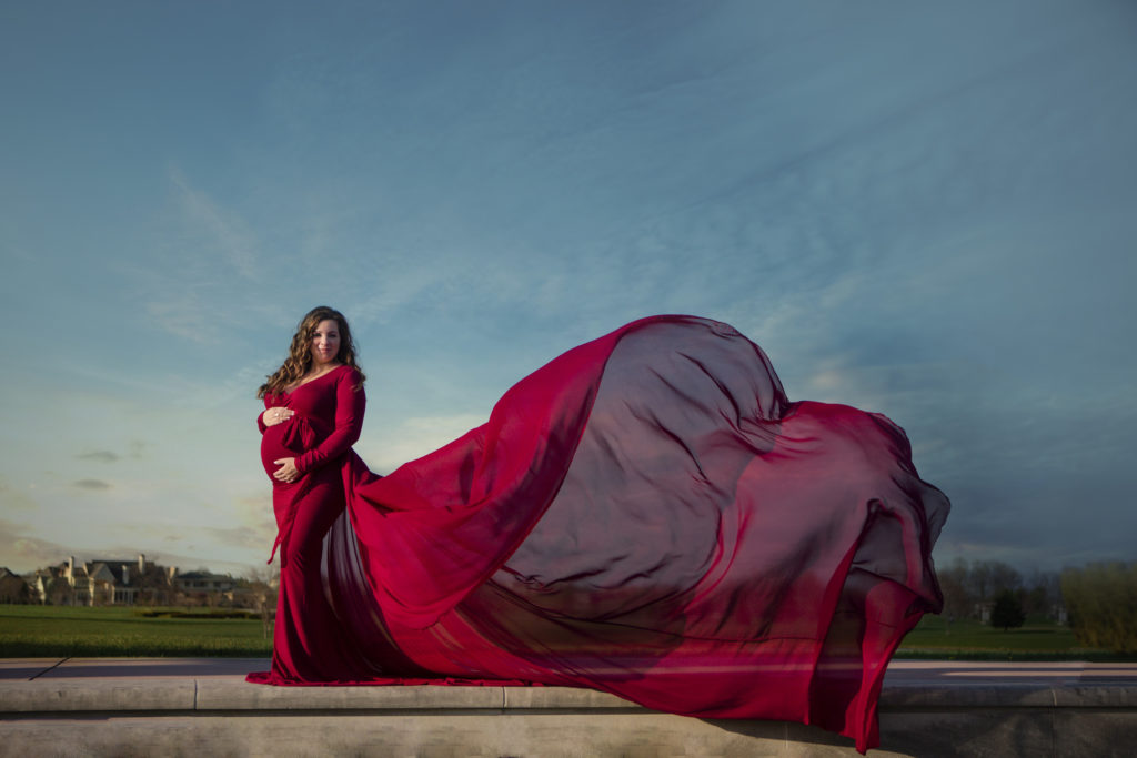 Maternity Photo in flowing dress displaying how beautiful flowing dresses can be for maternity photoshoot. 