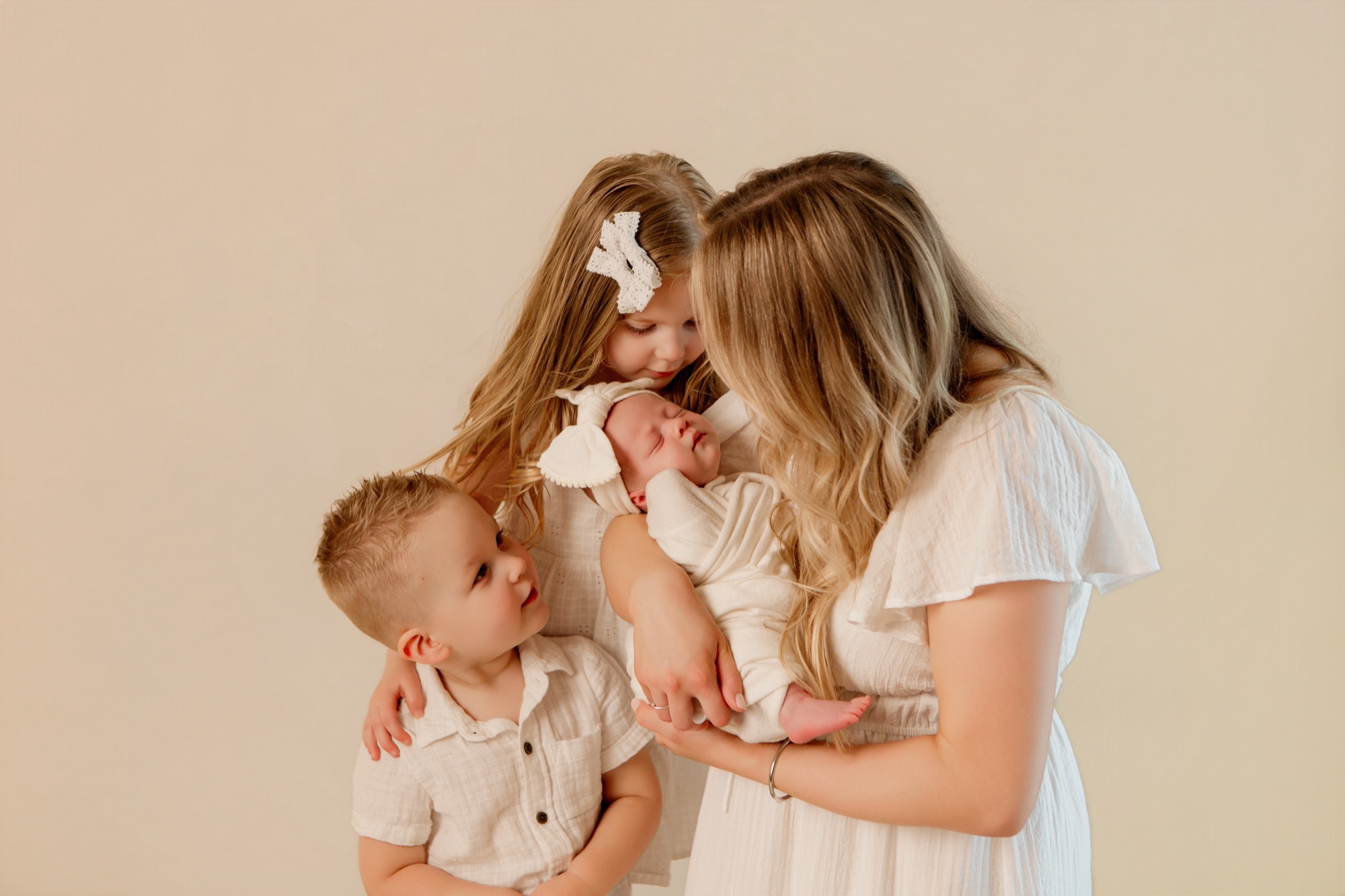 Noblesville newborn photographer captures siblings with new baby